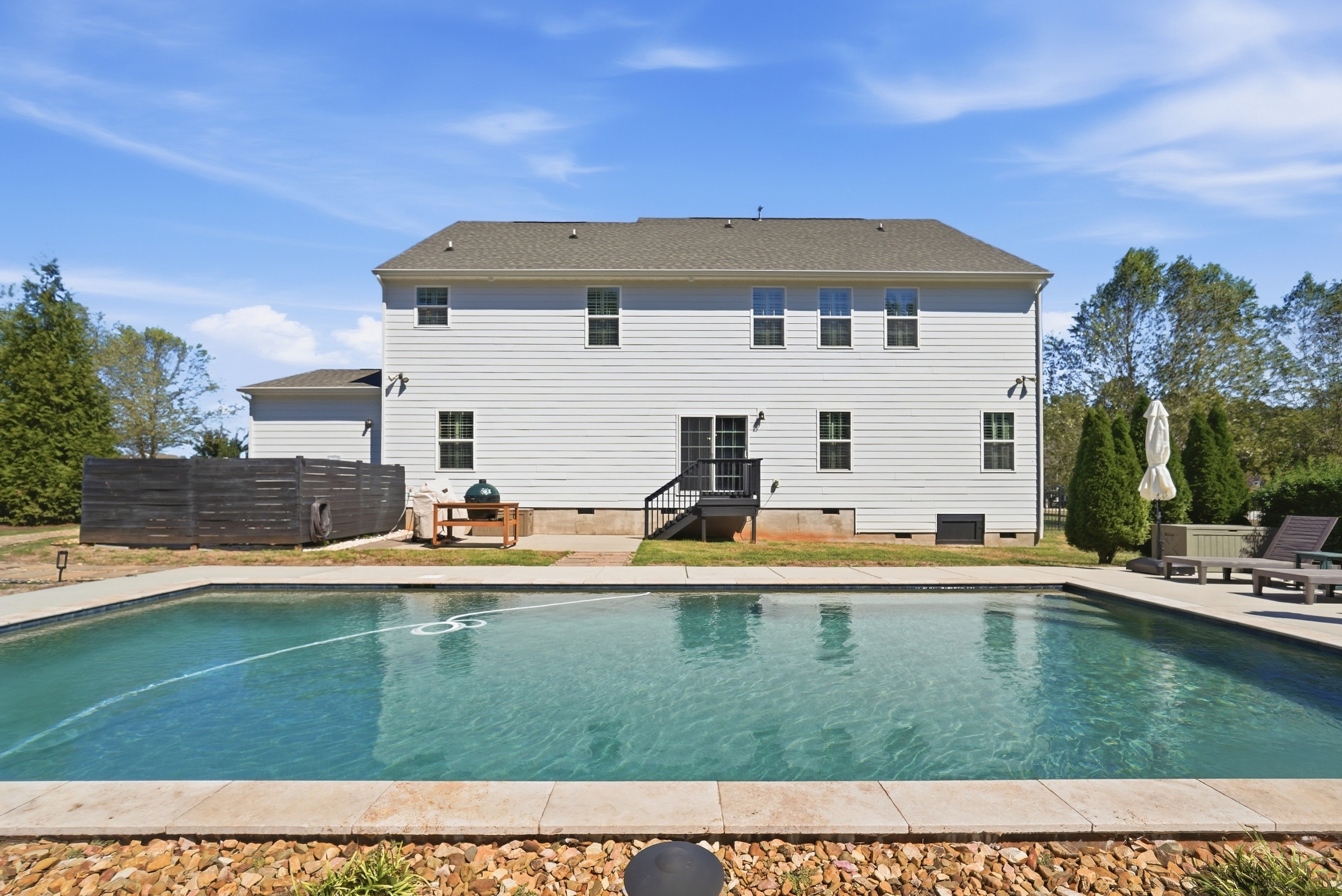 Pool with rear of home