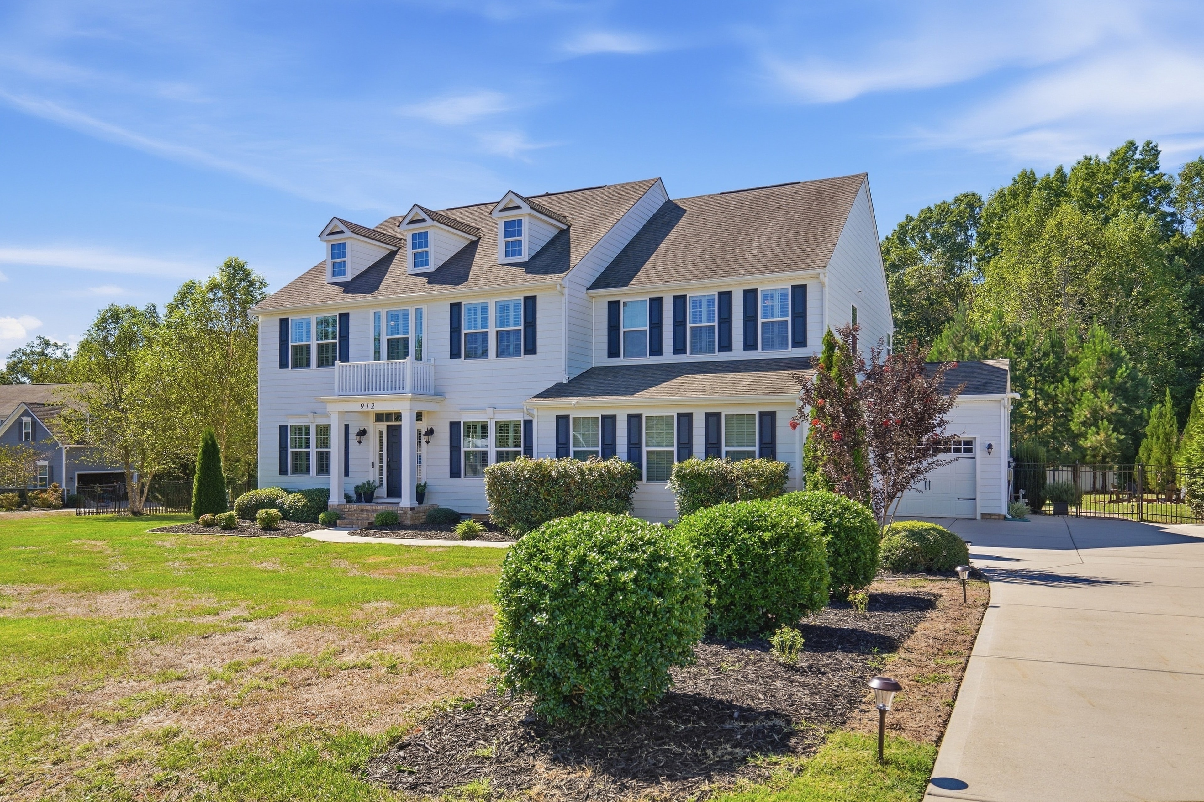 Front exterior — driveway side