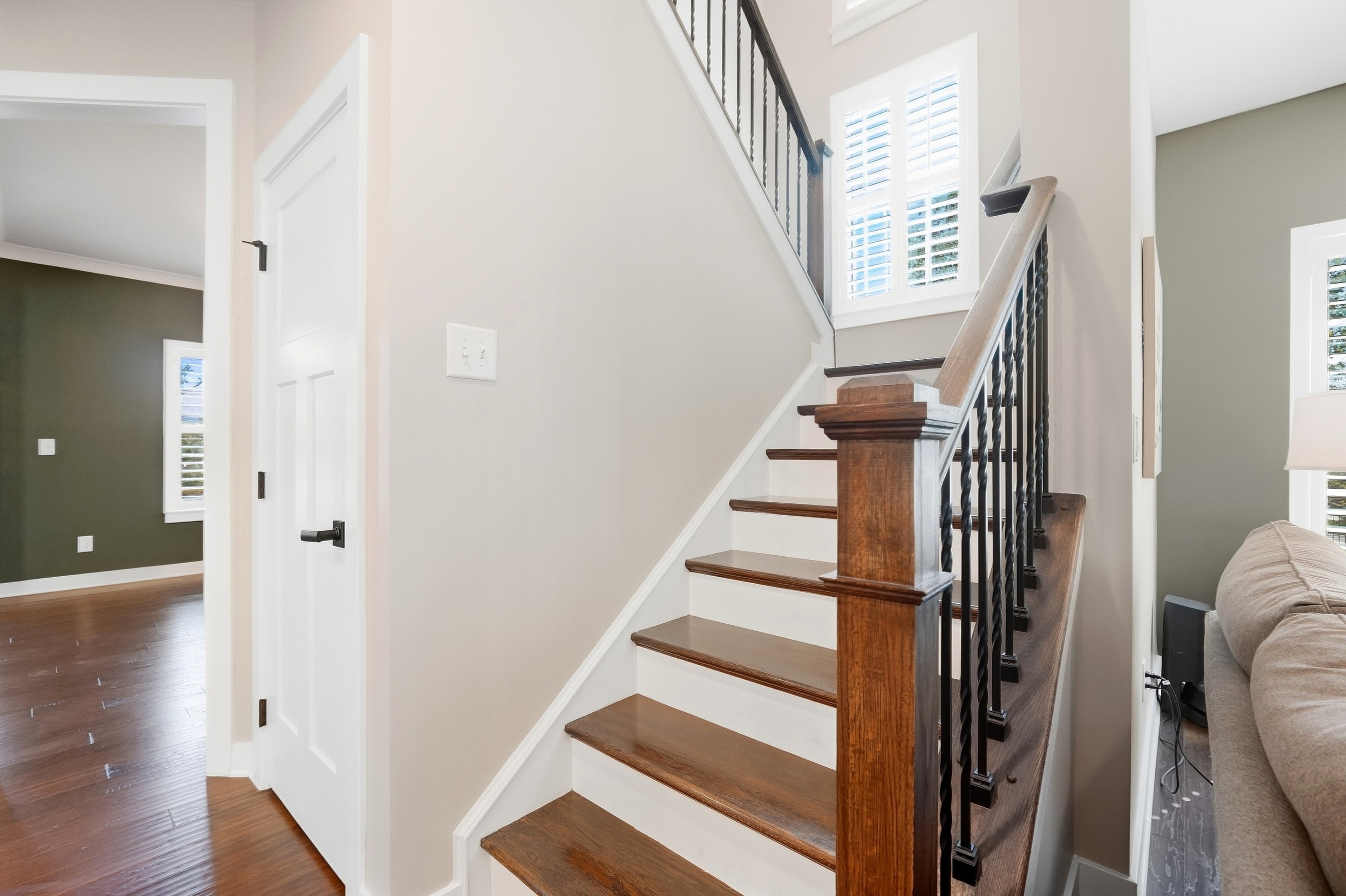 Staircase — hardwood treads & wrought iron balusters